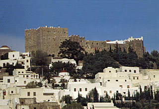 The fortified hilltop monastry of St. John, and the upspoilt Chora village which surrounds it on Patmos, Aegean islands, Greece